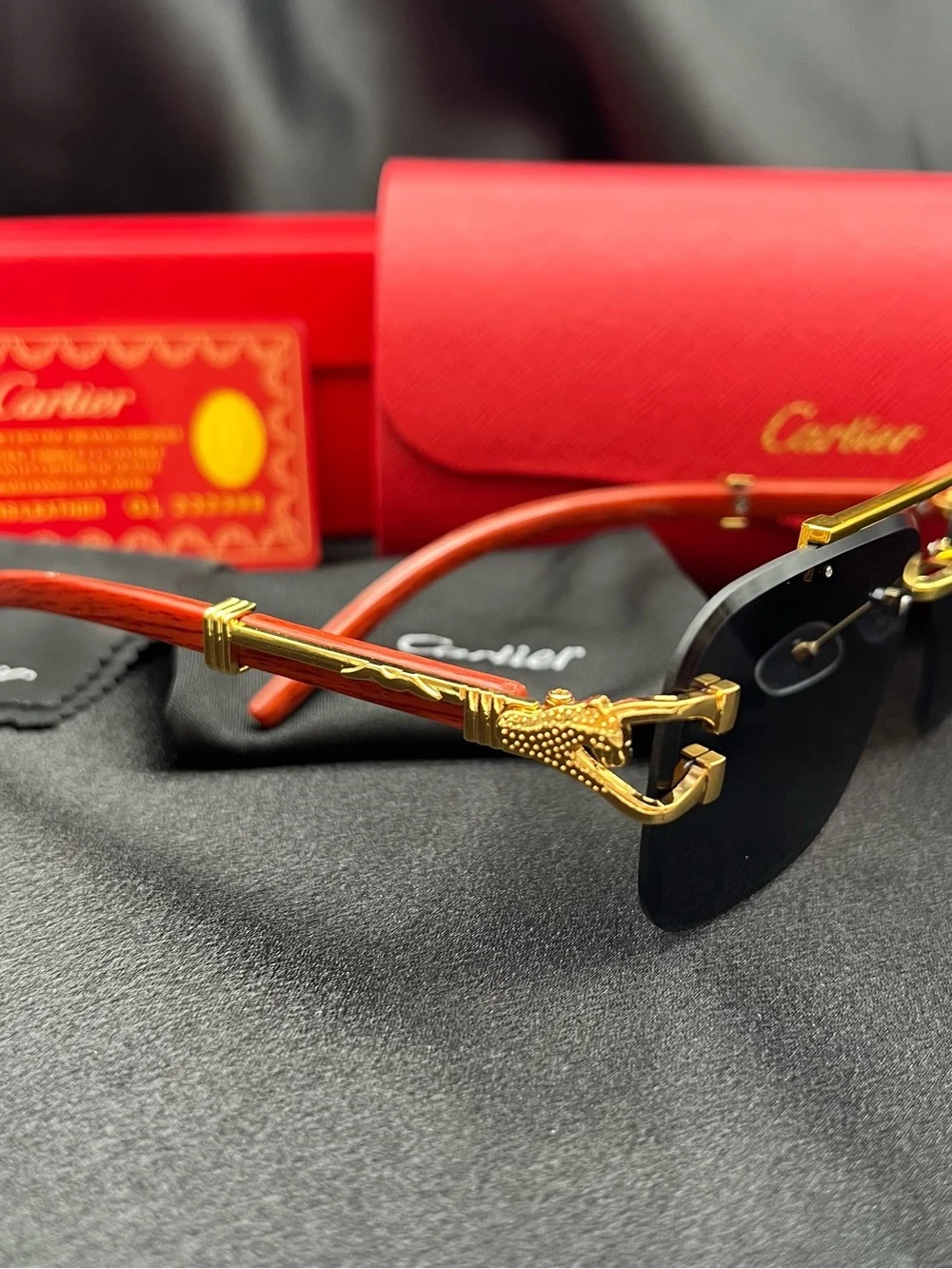 Cartier Men’s Black and Gold Rimless Sunglasses